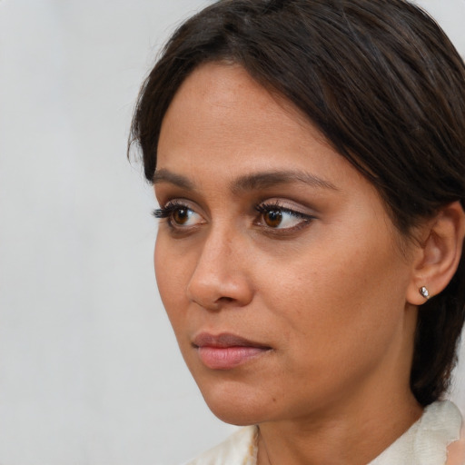 Neutral white young-adult female with medium  brown hair and brown eyes