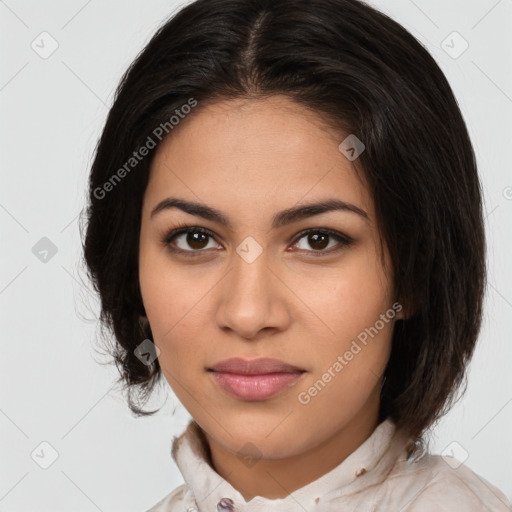 Joyful latino young-adult female with medium  brown hair and brown eyes