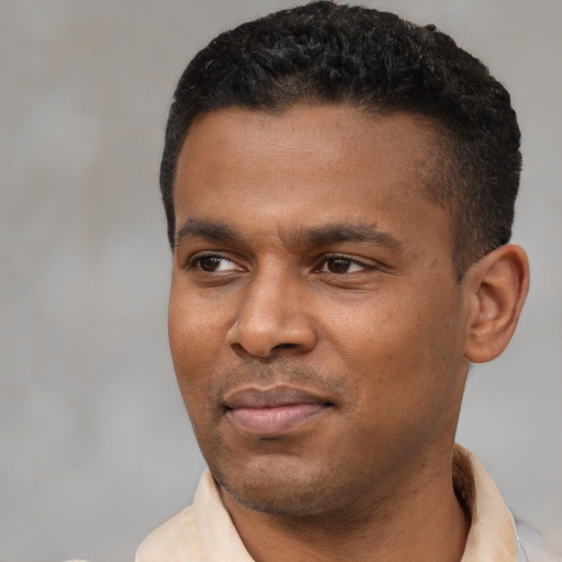 Neutral latino young-adult male with short  black hair and brown eyes