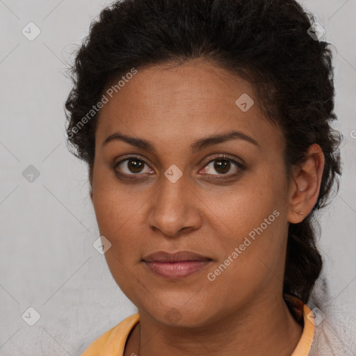 Joyful black young-adult female with medium  brown hair and brown eyes