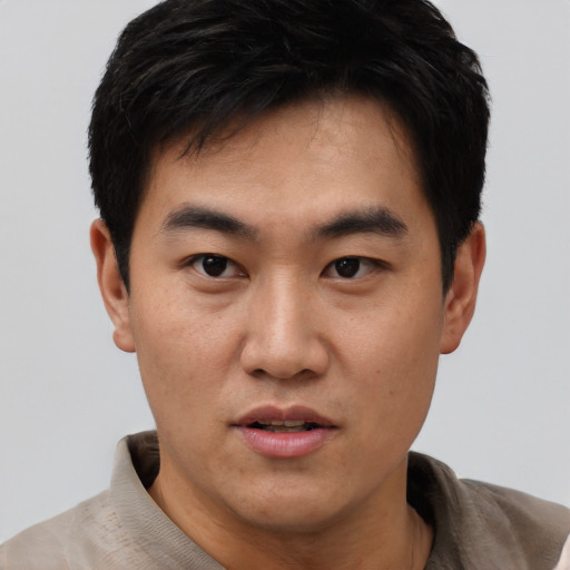 Neutral asian young-adult male with short  black hair and brown eyes