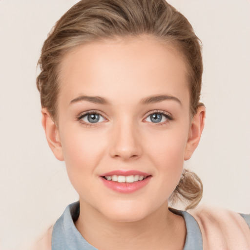 Joyful white child female with long  brown hair and grey eyes