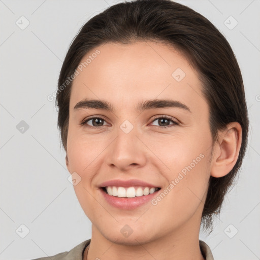 Joyful white young-adult female with medium  brown hair and brown eyes