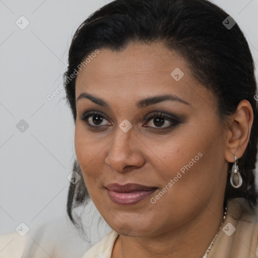 Joyful latino young-adult female with medium  brown hair and brown eyes