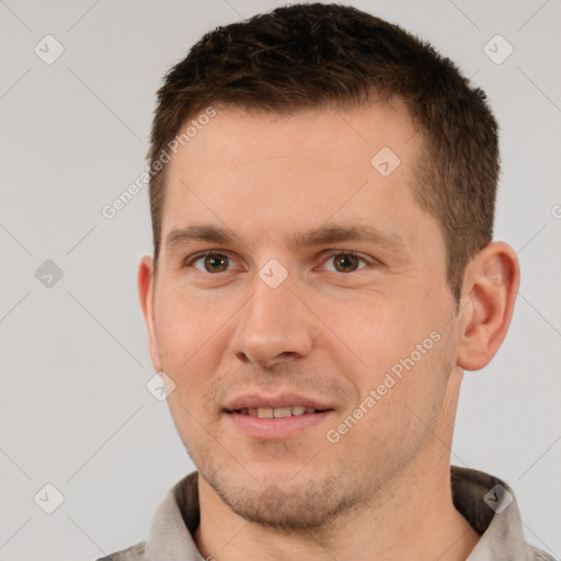 Joyful white young-adult male with short  brown hair and brown eyes