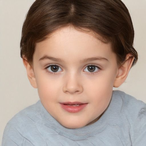 Joyful white child female with short  brown hair and brown eyes