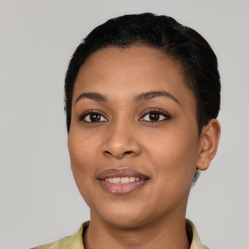 Joyful latino young-adult female with short  black hair and brown eyes