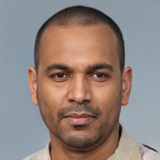 Neutral latino adult male with short  black hair and brown eyes