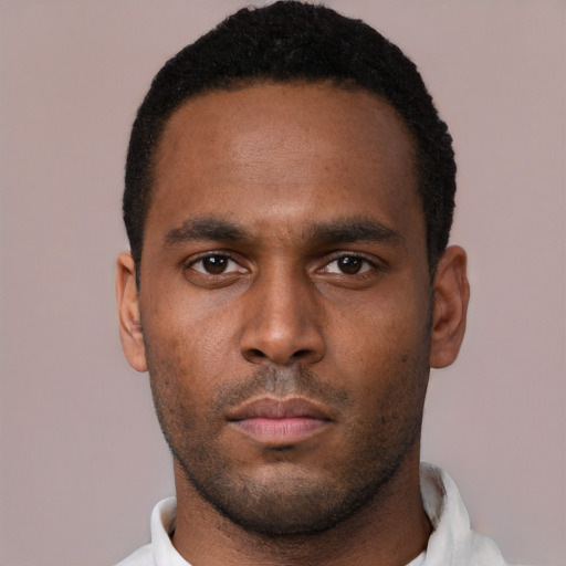 Neutral black young-adult male with short  black hair and brown eyes