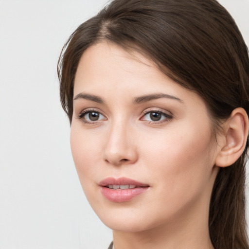 Neutral white young-adult female with long  brown hair and brown eyes