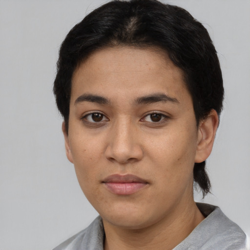 Neutral latino young-adult female with short  black hair and brown eyes