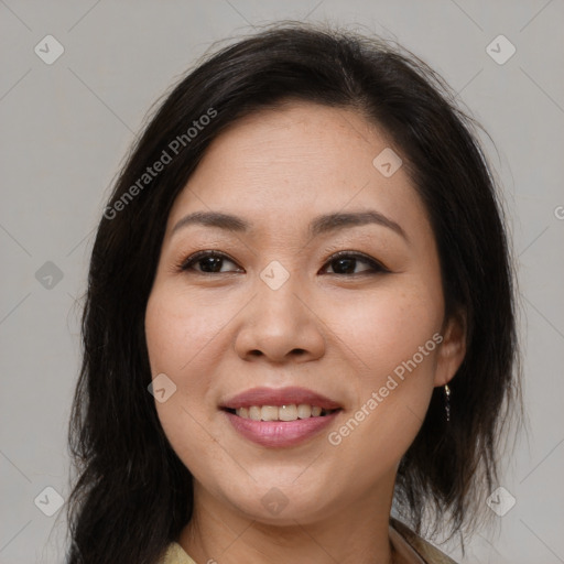 Joyful latino young-adult female with medium  brown hair and brown eyes