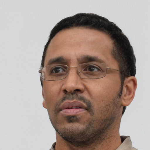 Neutral black adult male with short  black hair and brown eyes
