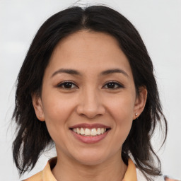 Joyful white young-adult female with medium  brown hair and brown eyes