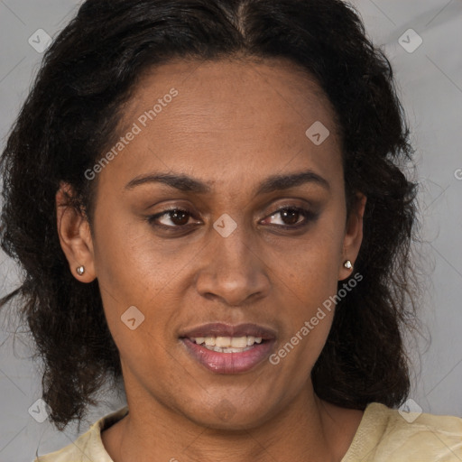 Joyful black adult female with medium  brown hair and brown eyes