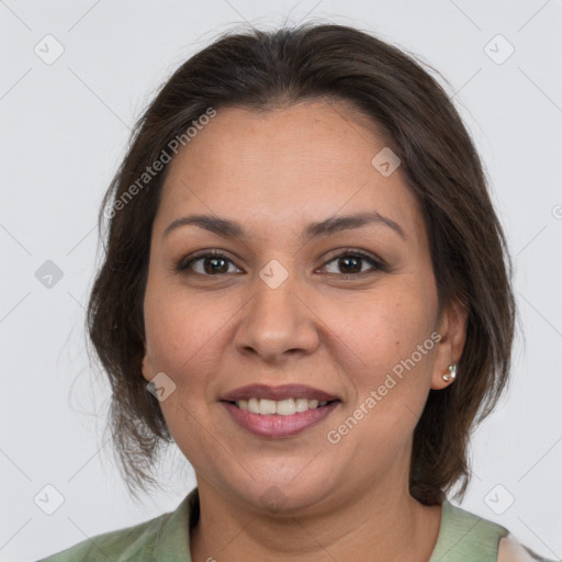 Joyful white adult female with medium  brown hair and brown eyes