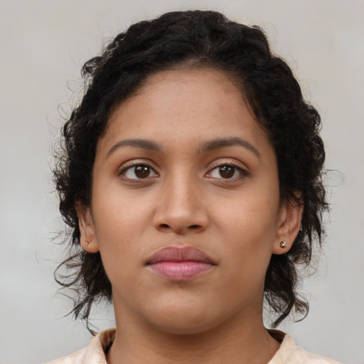 Neutral latino young-adult female with medium  brown hair and brown eyes