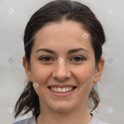 Joyful white young-adult female with medium  brown hair and brown eyes