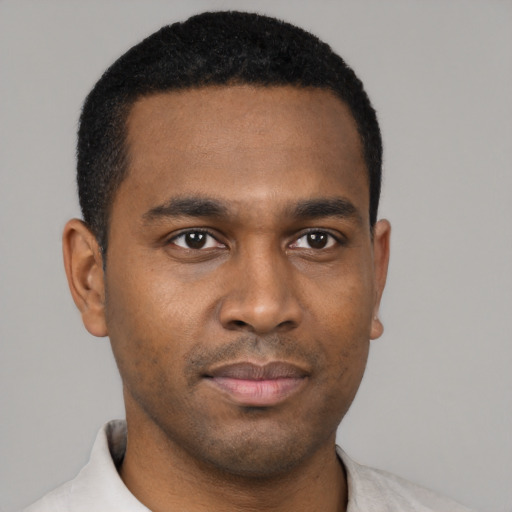 Neutral black young-adult male with short  black hair and brown eyes