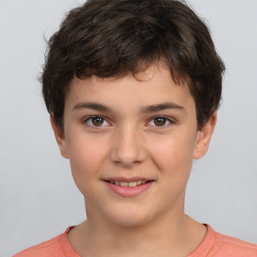 Joyful white child male with short  brown hair and brown eyes