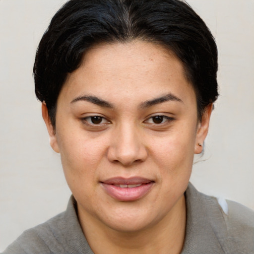 Joyful white young-adult female with short  brown hair and brown eyes