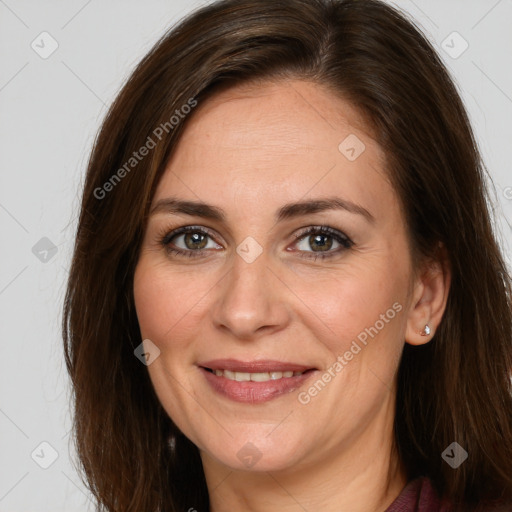 Joyful white adult female with long  brown hair and brown eyes