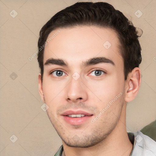 Joyful white young-adult male with short  black hair and brown eyes