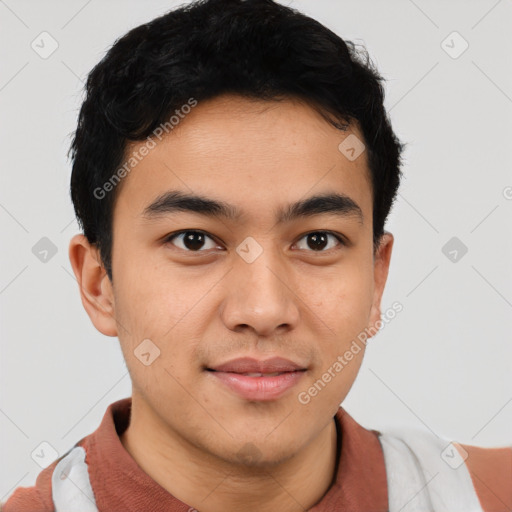 Joyful latino young-adult male with short  brown hair and brown eyes