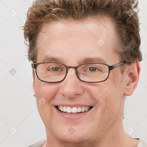 Joyful white adult male with short  brown hair and grey eyes