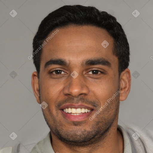 Joyful black young-adult male with short  black hair and brown eyes