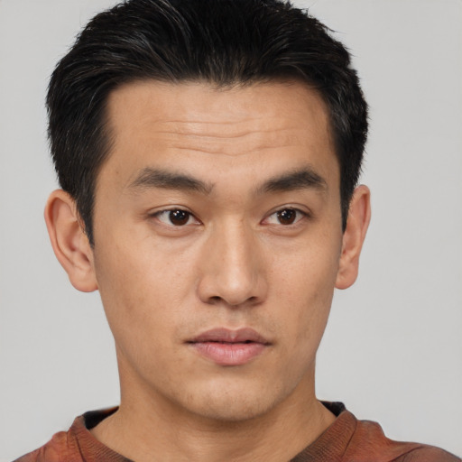 Neutral asian young-adult male with short  brown hair and brown eyes