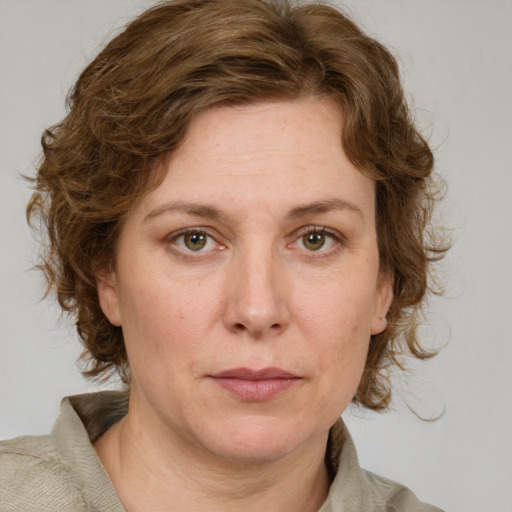 Neutral white adult female with medium  brown hair and green eyes