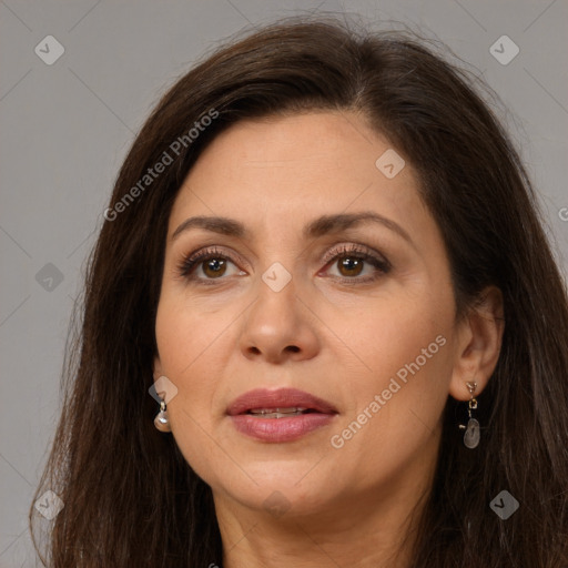 Joyful white adult female with long  brown hair and brown eyes