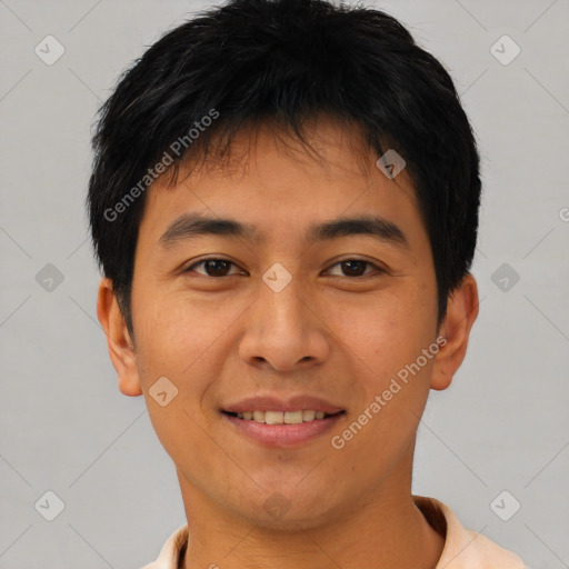 Joyful asian young-adult male with short  black hair and brown eyes