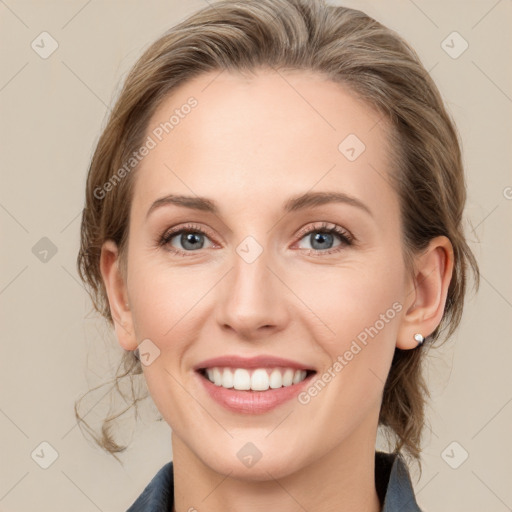 Joyful white young-adult female with medium  brown hair and blue eyes