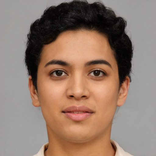 Joyful latino young-adult female with short  brown hair and brown eyes