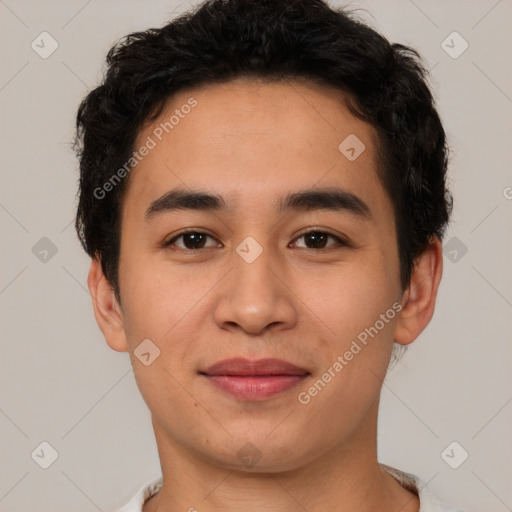 Joyful latino young-adult male with short  brown hair and brown eyes