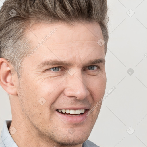 Joyful white adult male with short  brown hair and grey eyes