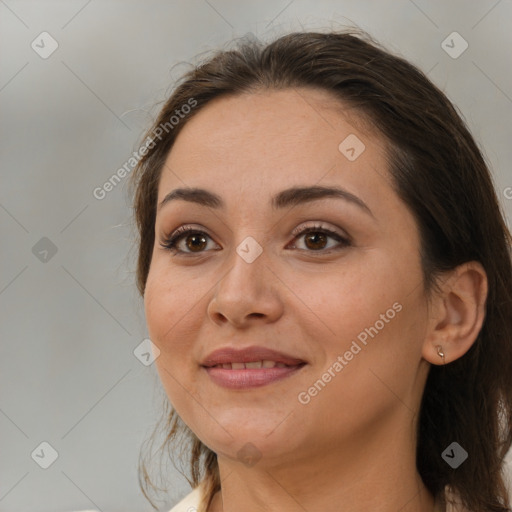 Joyful white adult female with medium  brown hair and brown eyes