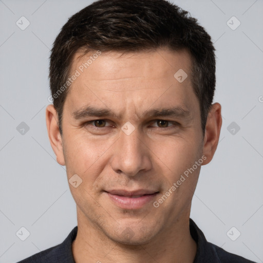 Joyful white adult male with short  brown hair and brown eyes