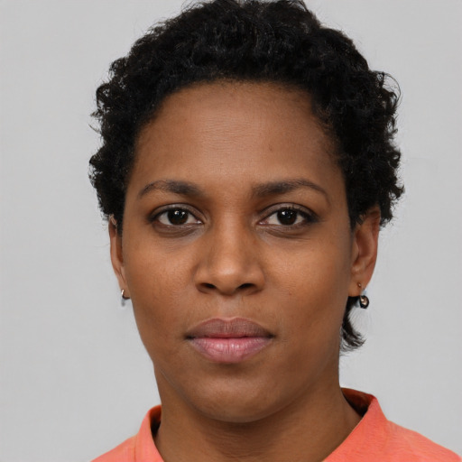 Neutral black young-adult female with short  black hair and brown eyes