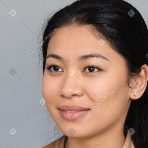 Joyful asian young-adult female with long  brown hair and brown eyes