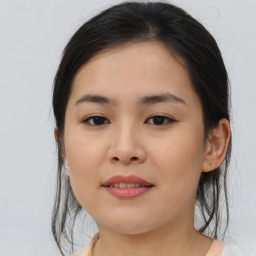 Joyful asian young-adult female with medium  brown hair and brown eyes