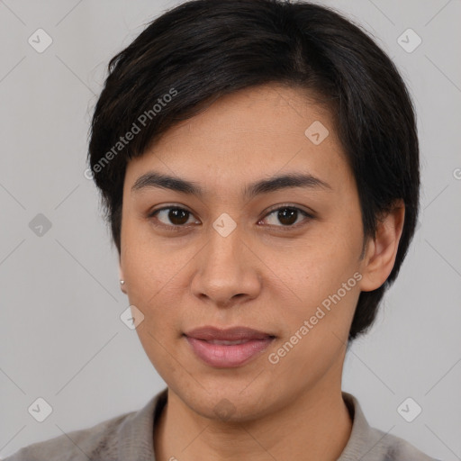 Joyful latino young-adult female with medium  brown hair and brown eyes