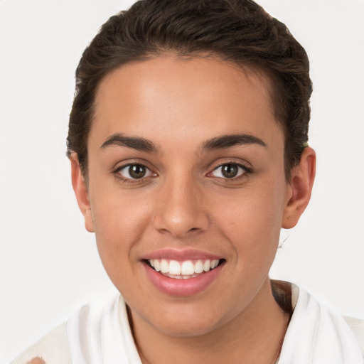 Joyful white young-adult female with short  brown hair and brown eyes