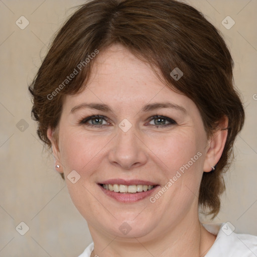 Joyful white adult female with medium  brown hair and grey eyes