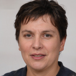 Joyful white adult female with short  brown hair and brown eyes