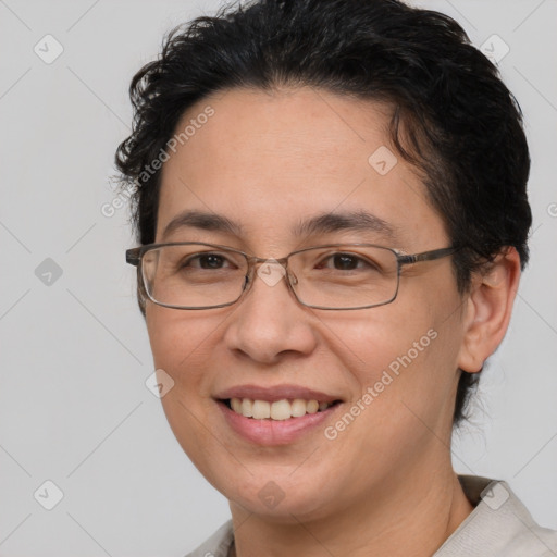 Joyful white adult female with short  brown hair and brown eyes