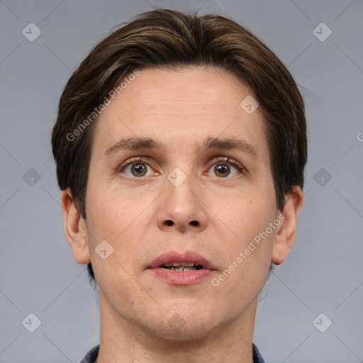 Joyful white adult male with short  brown hair and brown eyes