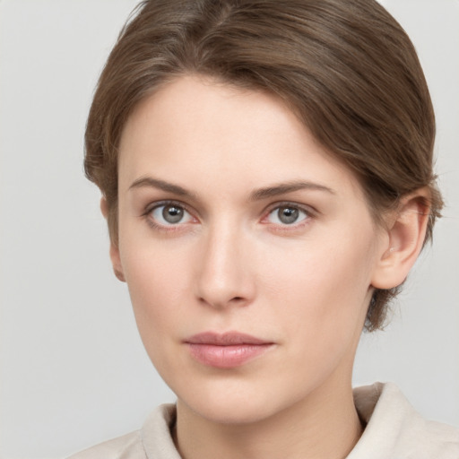 Neutral white young-adult female with short  brown hair and grey eyes